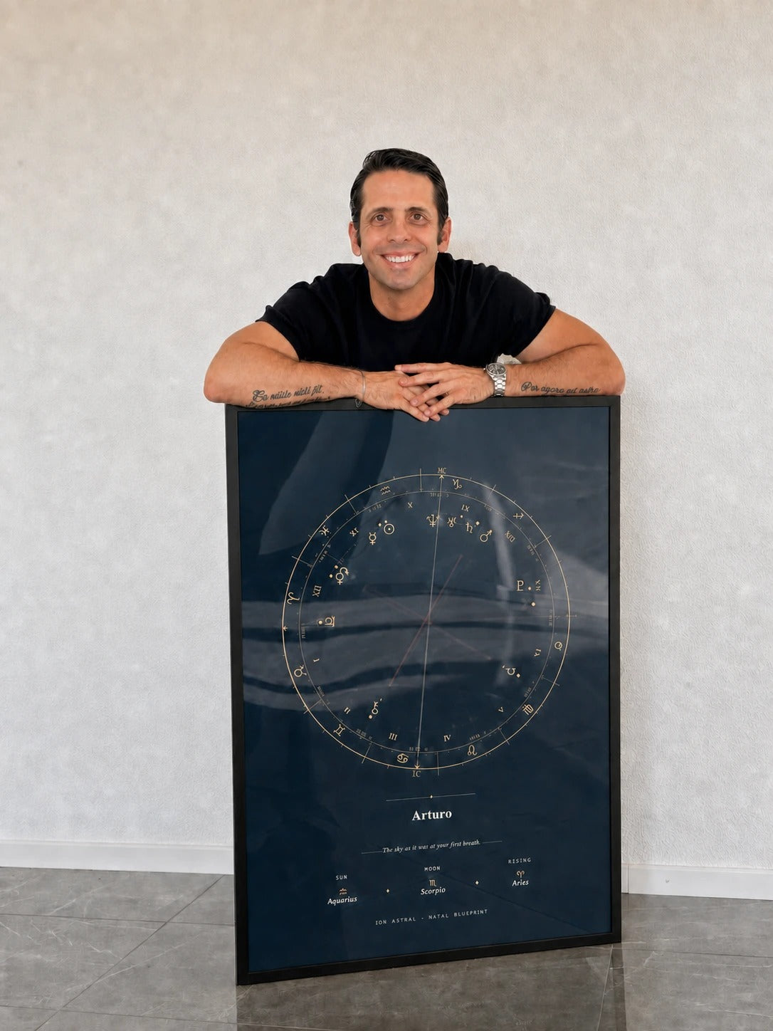 Arturo Gonzalez, founder of Ion Astral, with a printed and framed Natal Blueprint